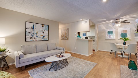 Living Room With Kitchen View at Indian Creek Apartments, Carrollton, Texas